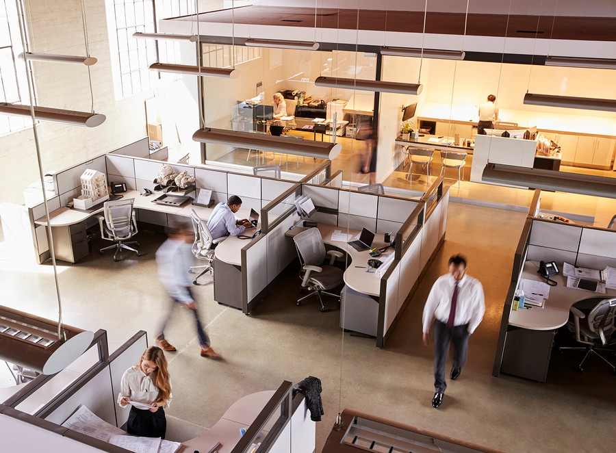 Overhead view of partially occupied open-plan office