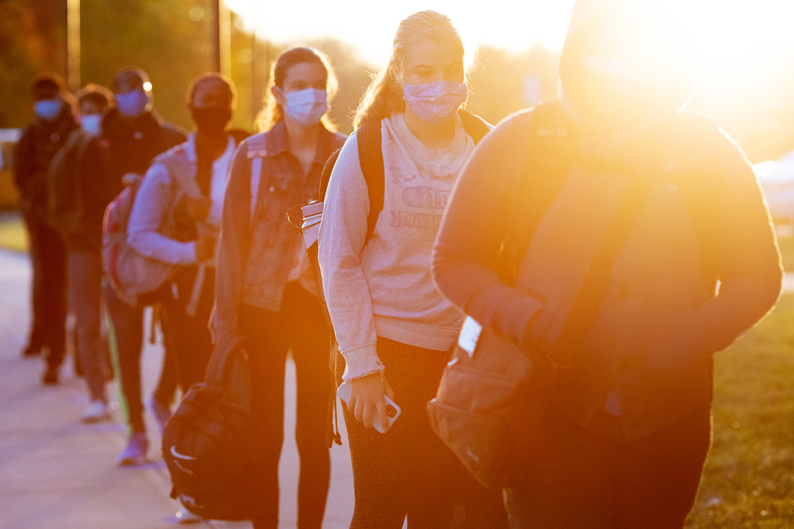 High schools students in COVID masks line up. Photo by Allison Shelley for EDUimages 