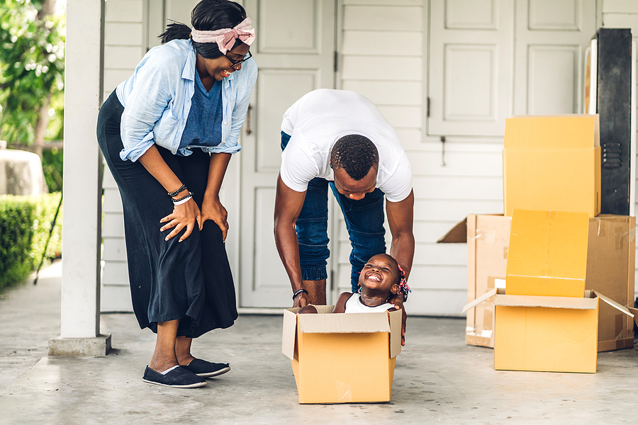 Happy family moving into their new home