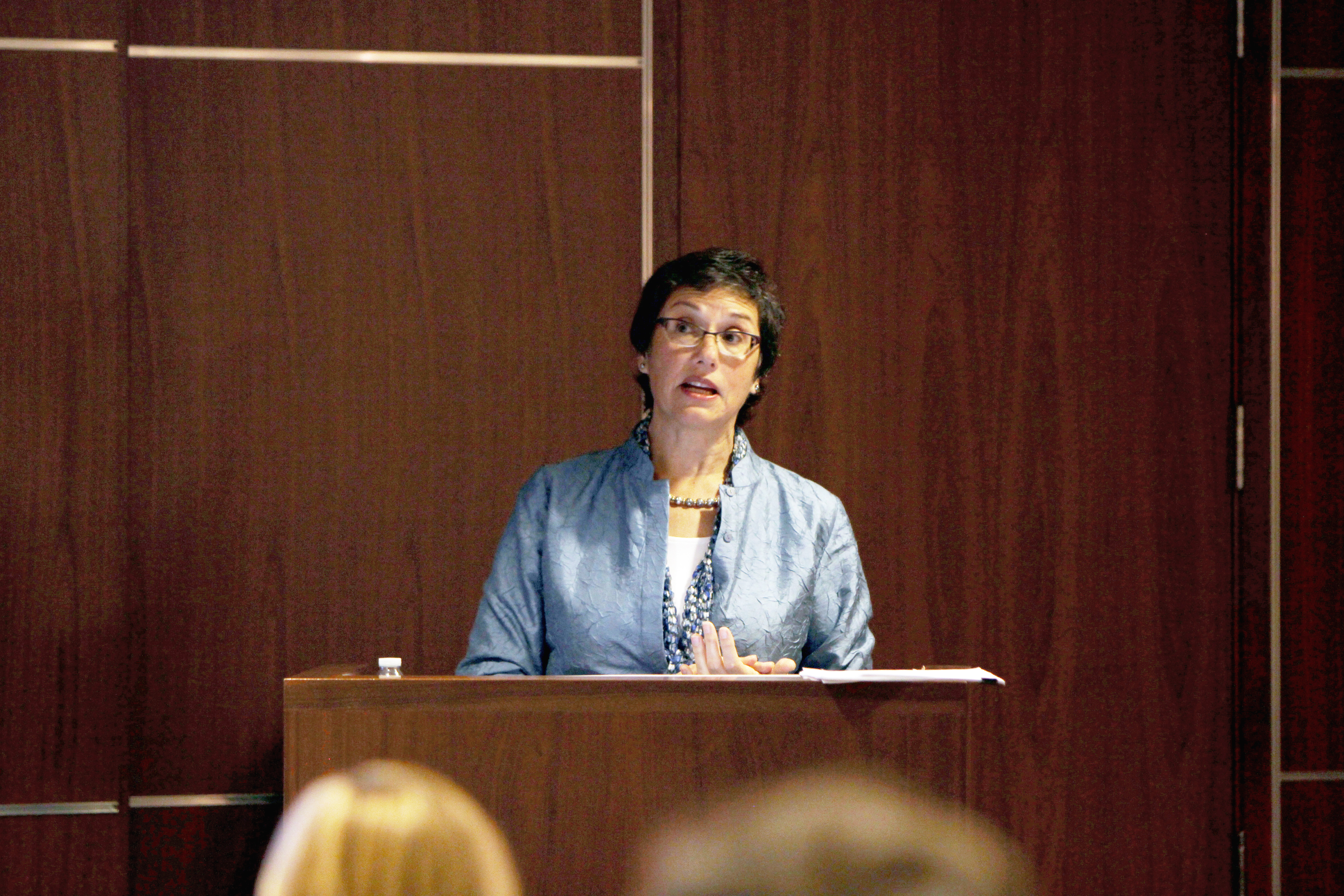 Erica Groshen presents at a lectern