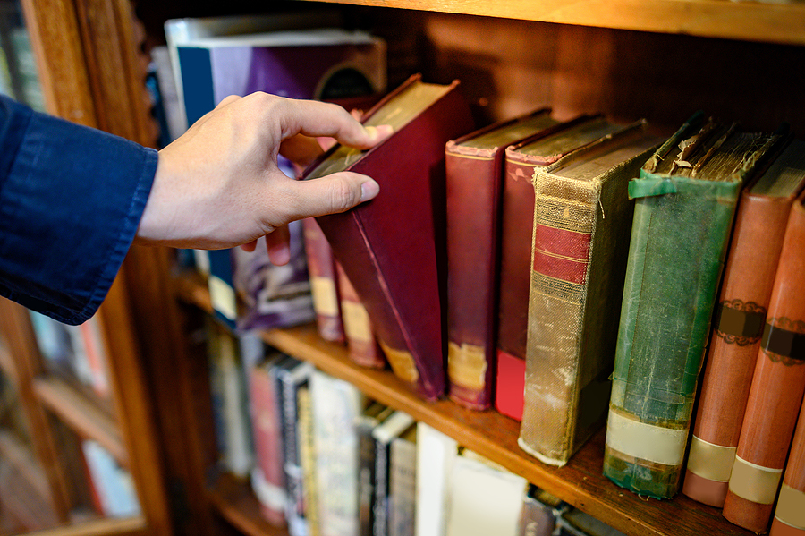 hand reaching for book