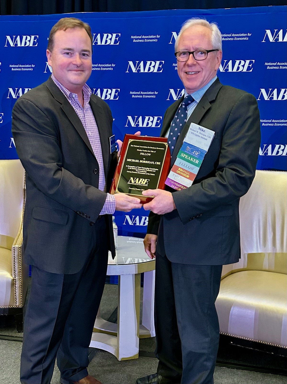 Michael Horrigan receives NABE fellowship plaque from NABE Executive Director Tom Beers