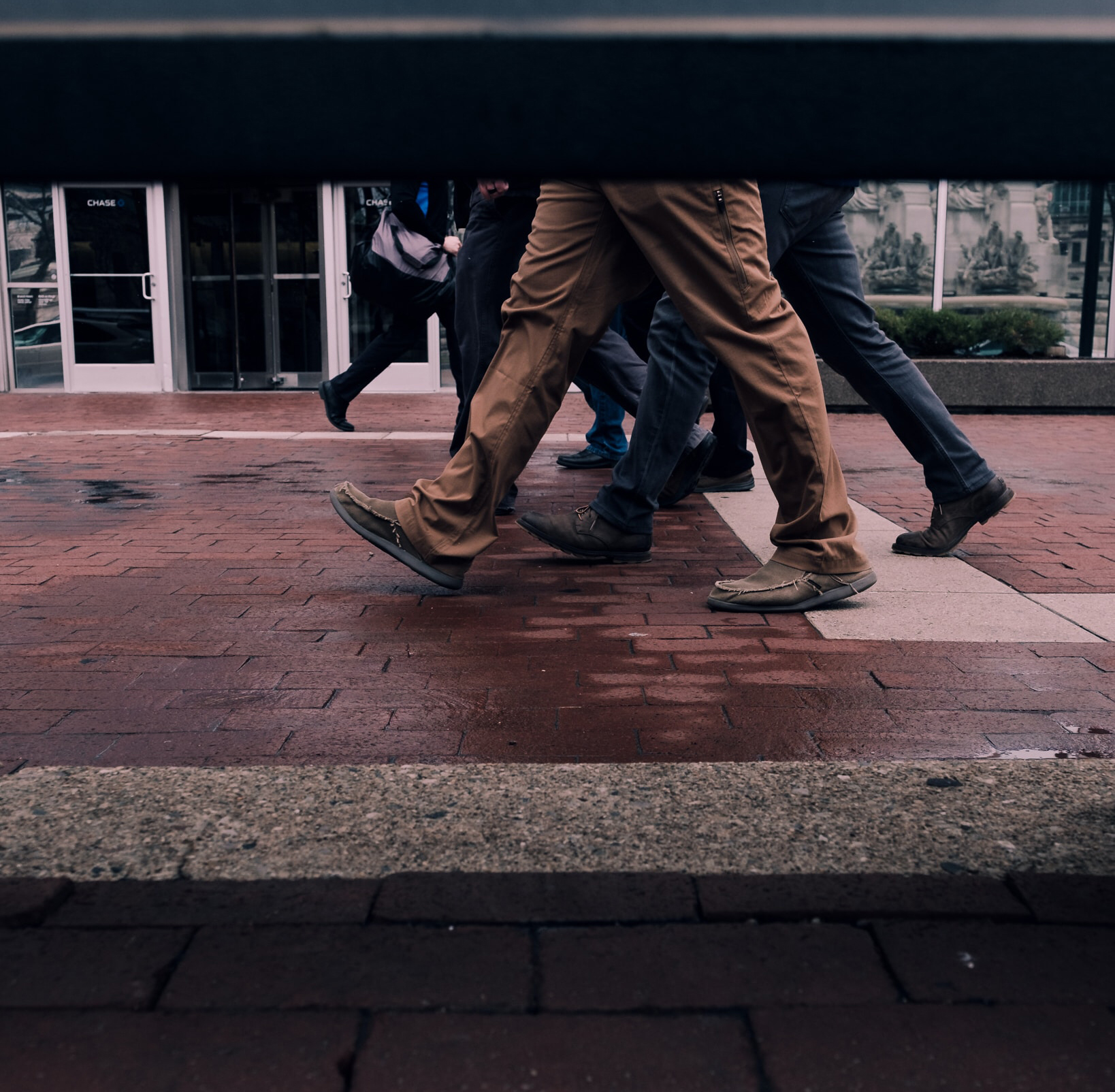 legs walking on brick road