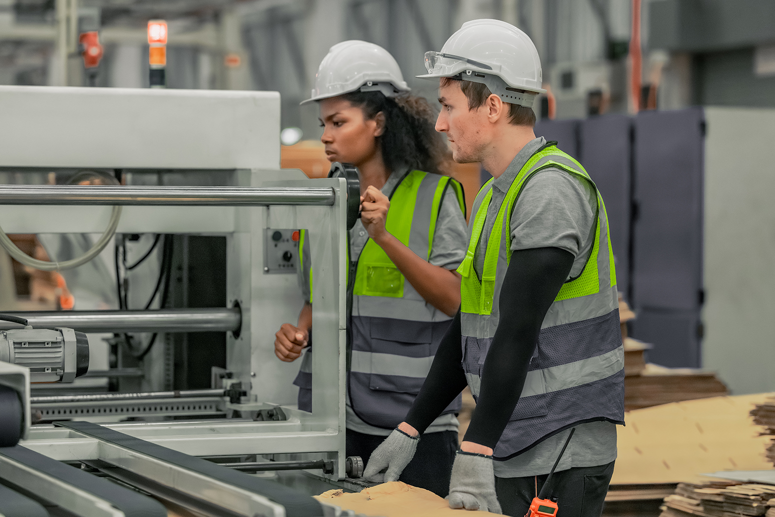 Workers on a cardboard factory line