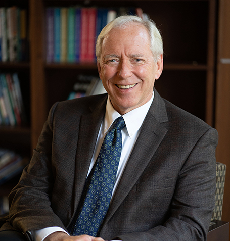 Mike Horrigan seated in office
