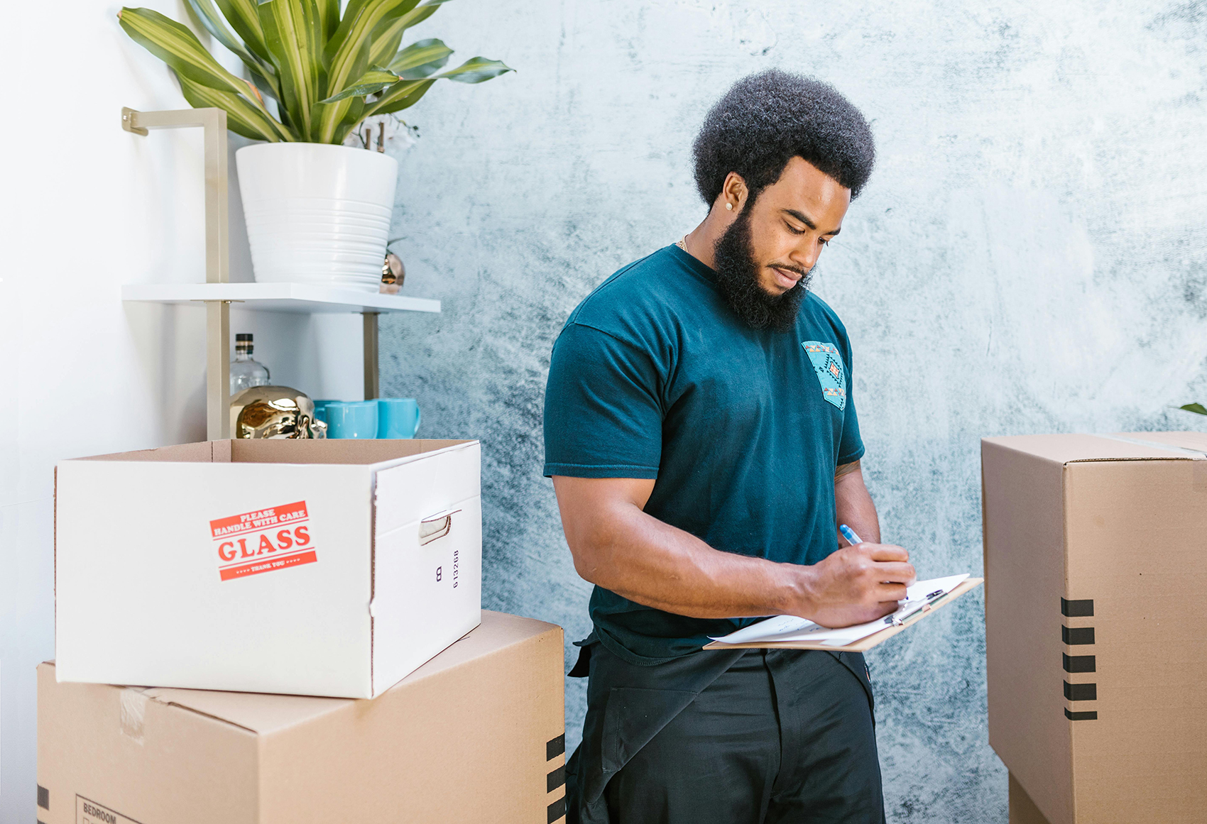 Mover unloads boxes of breakables, glass