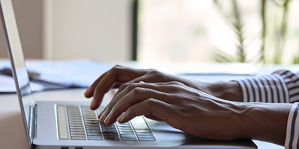student working on laptop computer
