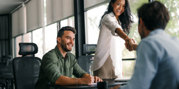 Business Team Shaking Hands During Office Meetingby nd3000