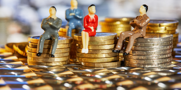 Figurines Sitting on Stacks of Gold and Silver Coinsby foodphotoalex