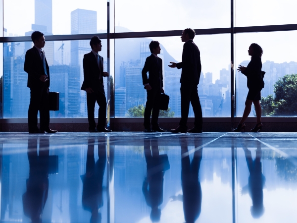 business people meeting in hallway