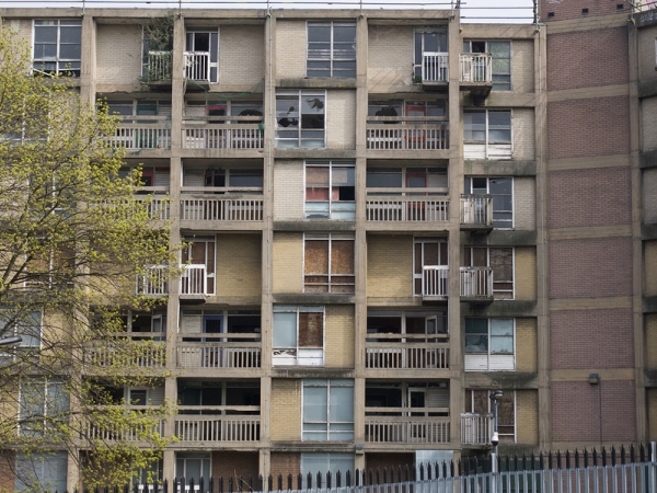 A run-down apartment building. New research shows long-term benefits of antipoverty policies in areas of concentrated poverty. 