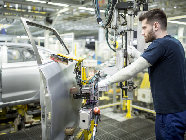 Man working in modern car factoryby westend61