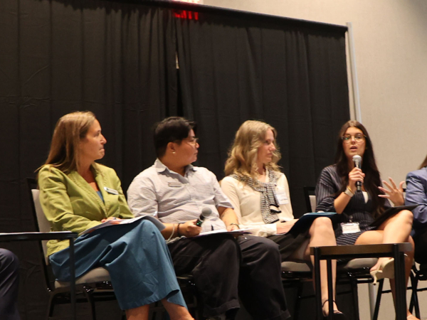 women on a conference panel