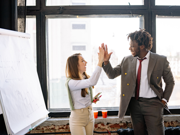Photo by Yan Krukau: https://www.pexels.com/photo/a-man-and-a-woman-in-business-attire-doing-high-five-7792858/ 
