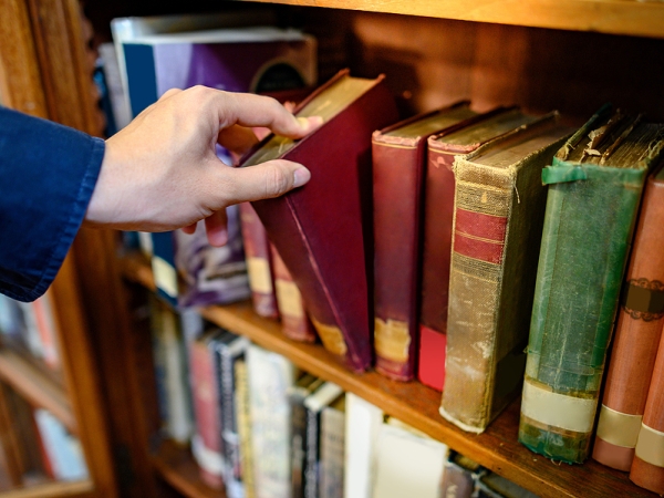 hand reaching for book