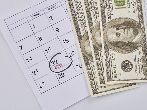 Illustration: calendar with date circled, U.S. cash