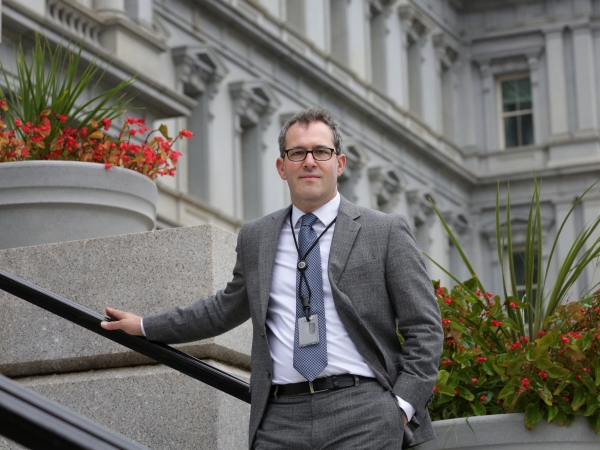 Aaron Sojourner in front of Minnesota building