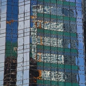 construction crane in building reflection