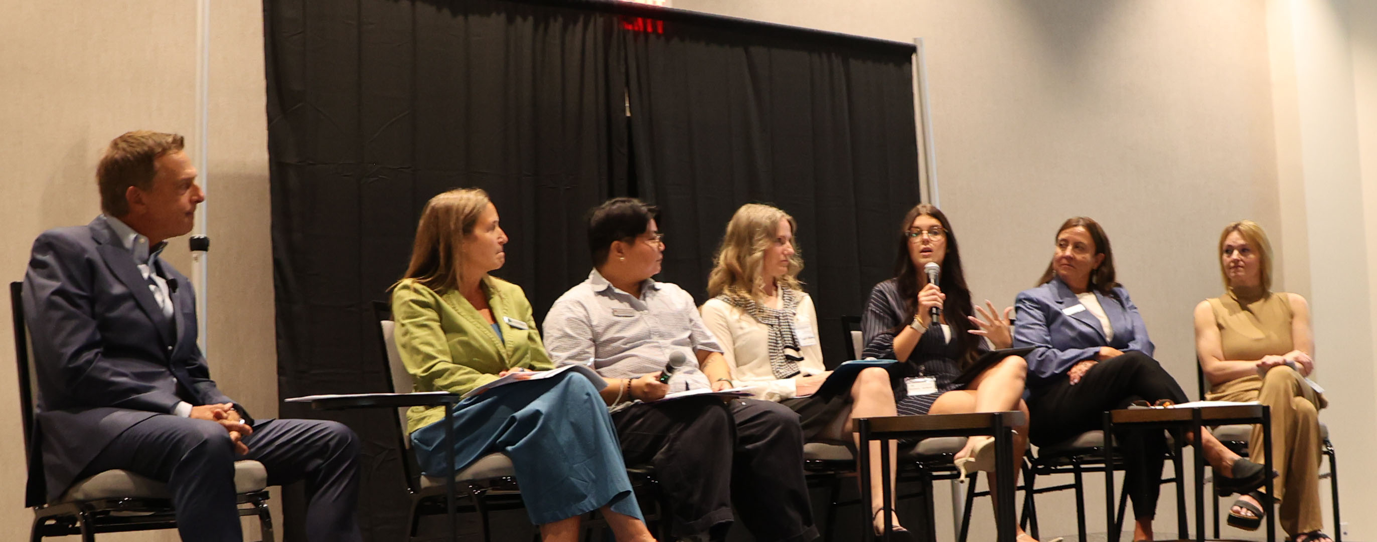 women on a conference panel