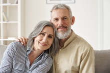 mature couple sitting on couch