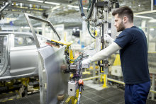 Man working in modern car factoryby westend61