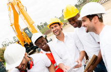 Construction Crew Laughing at Work Site with Excavatorby ESBProfessional